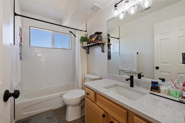 full bathroom featuring vanity, toilet, and shower / bath combo with shower curtain