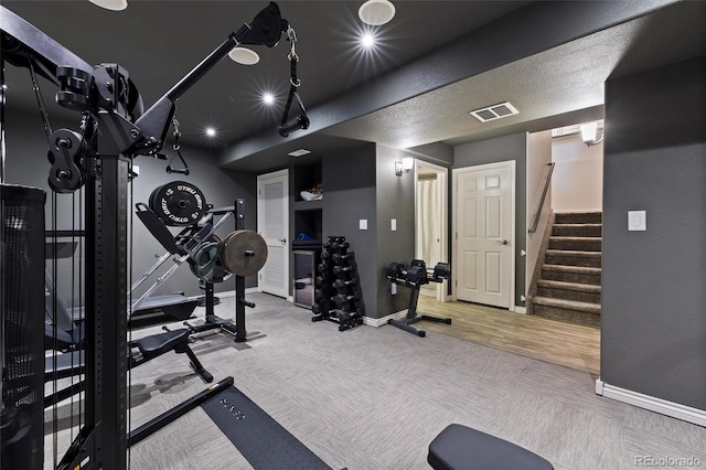 gym featuring carpet