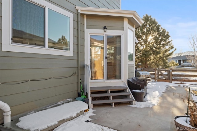 view of snow covered property entrance