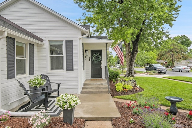2212 Ingalls St, Edgewater, CO 80214 - view of exterior entry with a lawn