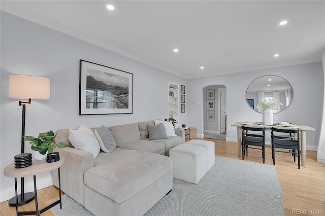 2212 Ingalls St, Edgewater, CO 80214 - living room with arched walkways, crown molding, recessed lighting, and light wood finished floors