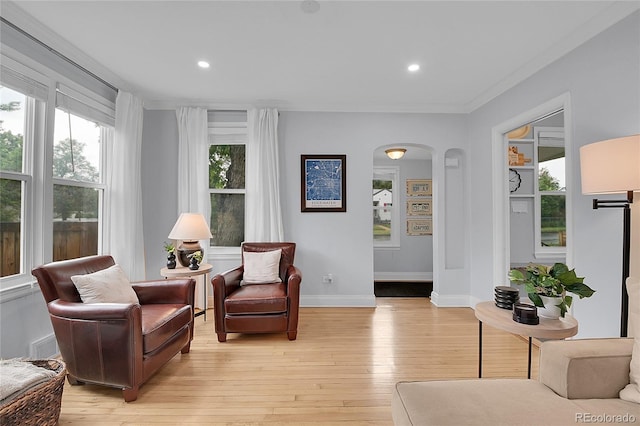 2212 Ingalls St, Edgewater, CO 80214 - living area with arched walkways, light wood-style floors, and recessed lighting