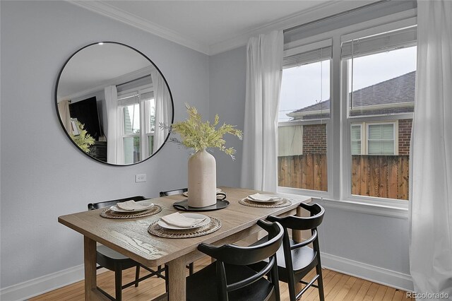 2212 Ingalls St, Edgewater, CO 80214 - dining room featuring ornamental molding and light wood-type flooring