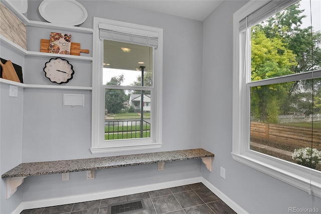 2212 Ingalls St, Edgewater, CO 80214 - mudroom featuring baseboards and dark tile patterned flooring