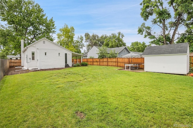 2212 Ingalls St, Edgewater, CO 80214 - fenced backyard with a storage unit