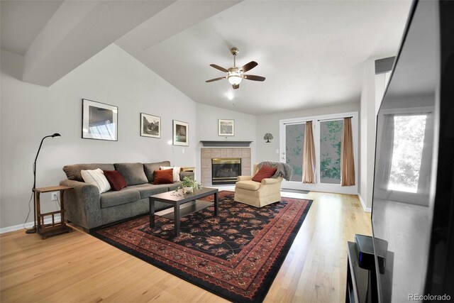 5283 Union Ct Unit 8, Arvada, CO 80002 - living room featuring lofted ceiling, ceiling fan, wood finished floors, a fireplace, and baseboards