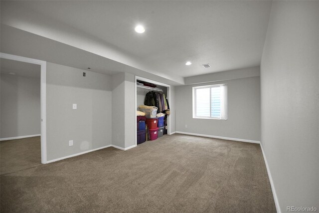 5283 Union Ct Unit 8, Arvada, CO 80002 - below grade area featuring carpet flooring, baseboards, and recessed lighting
