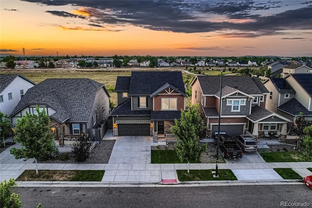 15595 E 47th Dr, Denver, CO 80239 - craftsman-style house with driveway, a residential view, and an attached garage