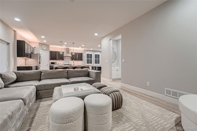 15595 E 47th Dr, Denver, CO 80239 - living room with light wood-style flooring and recessed lighting