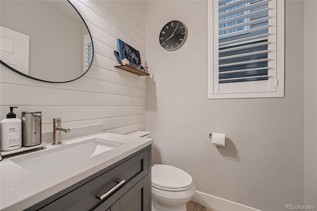 15595 E 47th Dr, Denver, CO 80239 - bathroom with wood walls and vanity