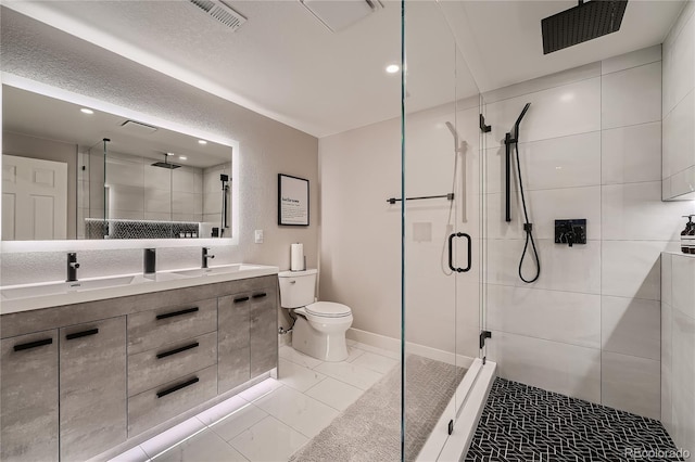 15595 E 47th Dr, Denver, CO 80239 - bathroom with a shower stall, double vanity, and recessed lighting