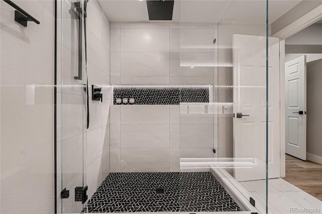 15595 E 47th Dr, Denver, CO 80239 - full bathroom with a stall shower and wood finished floors