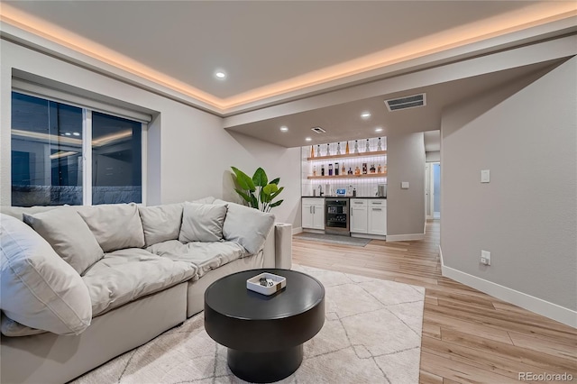 15595 E 47th Dr, Denver, CO 80239 - living area with wine cooler, a dry bar, light wood-type flooring, and recessed lighting