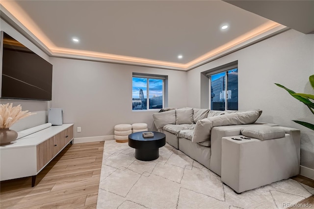 15595 E 47th Dr, Denver, CO 80239 - living area featuring a tray ceiling, light wood-style floors, and recessed lighting