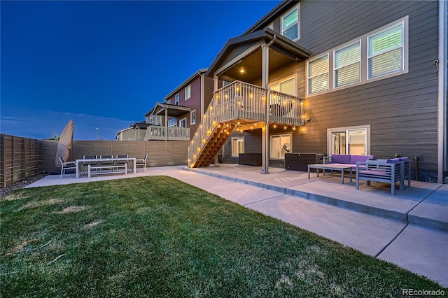 15595 E 47th Dr, Denver, CO 80239 - back of property with a patio, outdoor lounge area, stairs, and a wooden deck