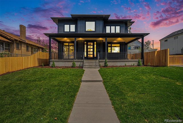 view of front of home featuring a yard and covered porch