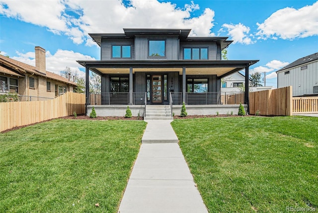 view of front facade featuring a front lawn and a porch