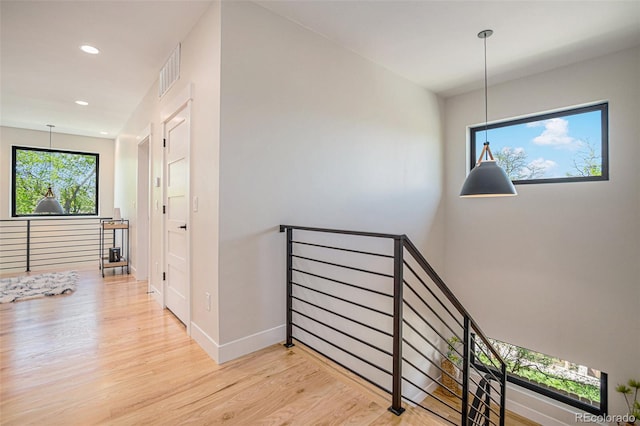 stairway with light wood-type flooring