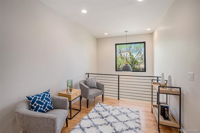 sitting room with light hardwood / wood-style flooring