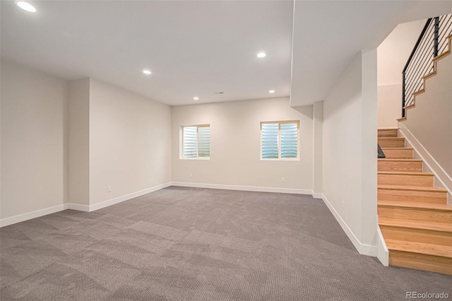 empty room with dark colored carpet