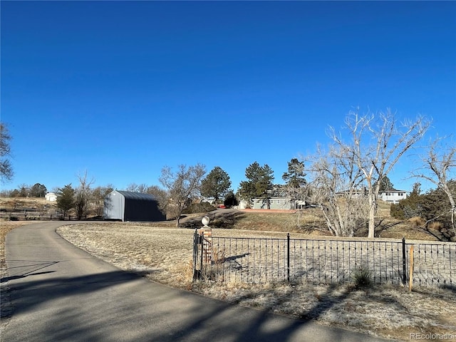 view of road featuring aphalt driveway