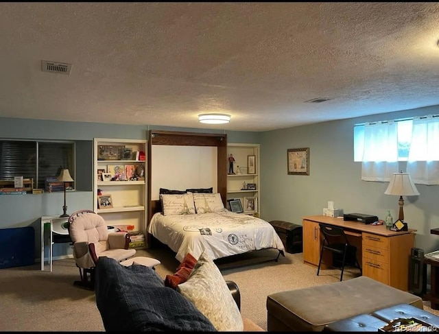 carpeted bedroom with a textured ceiling