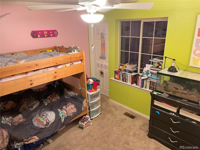 bedroom featuring carpet floors, visible vents, baseboards, and a ceiling fan