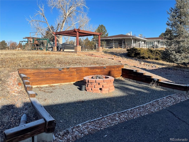 view of yard featuring a gazebo and a fire pit