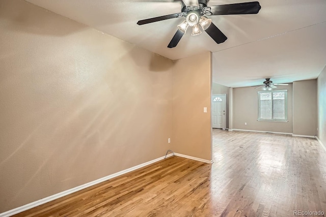 empty room featuring light wood-type flooring and ceiling fan