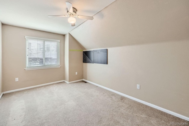 bonus room featuring carpet flooring, ceiling fan, and vaulted ceiling