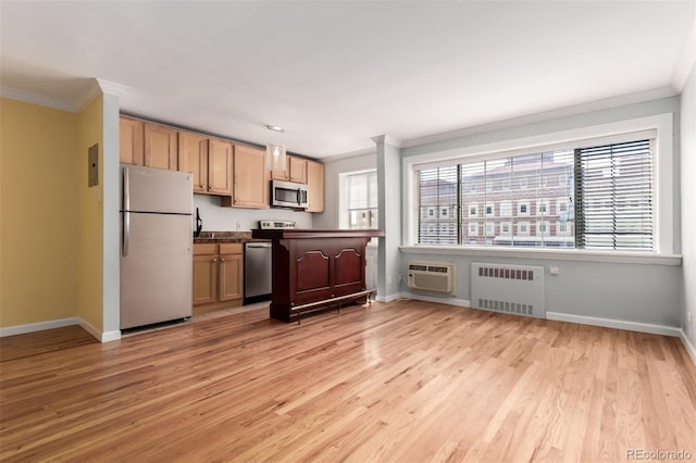 1450 Albion St Unit 204, Denver, CO 80220 - kitchen with appliances with stainless steel finishes, radiator heating unit, ornamental molding, light wood-style flooring, and a wall mounted AC