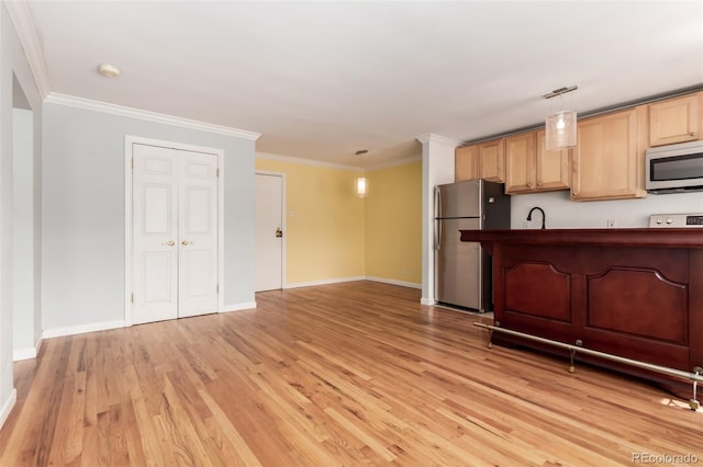 1450 Albion St Unit 204, Denver, CO 80220 - kitchen with stainless steel appliances, light wood-style flooring, dark countertops, ornamental molding, and decorative light fixtures