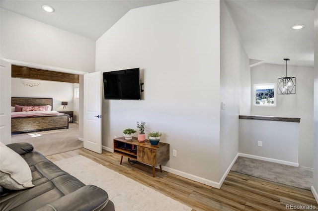 10617 County Rd 1, Florissant, CO 80816 - living room with wood finished floors, baseboards, recessed lighting, and high vaulted ceiling