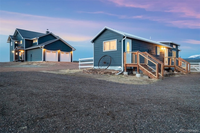 10617 County Rd 1, Florissant, CO 80816 - view of property exterior with driveway and an attached garage