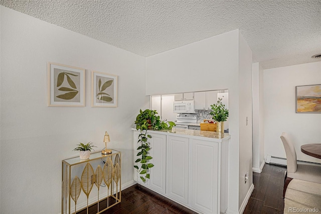 64 Nome Way Unit A, Aurora, CO 80012 - kitchen with white appliances, dark wood finished floors, a textured ceiling, white cabinetry, and light countertops