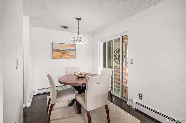 64 Nome Way Unit A, Aurora, CO 80012 - dining space with baseboard heating, dark wood-type flooring, healthy amount of natural light, a chandelier, and a textured ceiling