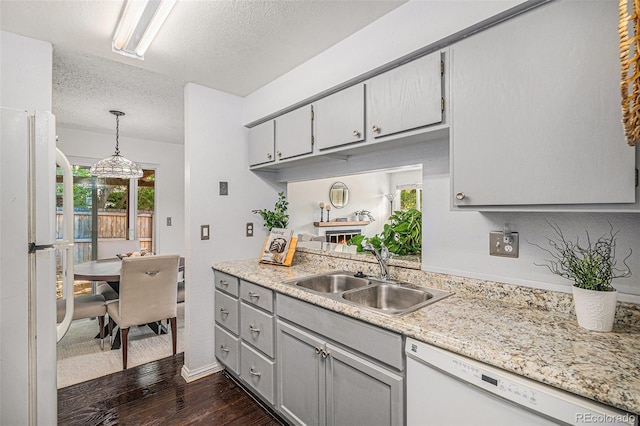 64 Nome Way Unit A, Aurora, CO 80012 - kitchen with white appliances, gray cabinets, a textured ceiling, dark wood-style flooring, and pendant lighting