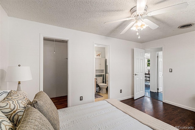 64 Nome Way Unit A, Aurora, CO 80012 - bedroom with dark wood-style floors, a textured ceiling, a ceiling fan, a closet, and ensuite bathroom