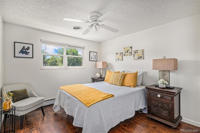 64 Nome Way Unit A, Aurora, CO 80012 - bedroom with a textured ceiling, wood finished floors, a baseboard radiator, and a ceiling fan