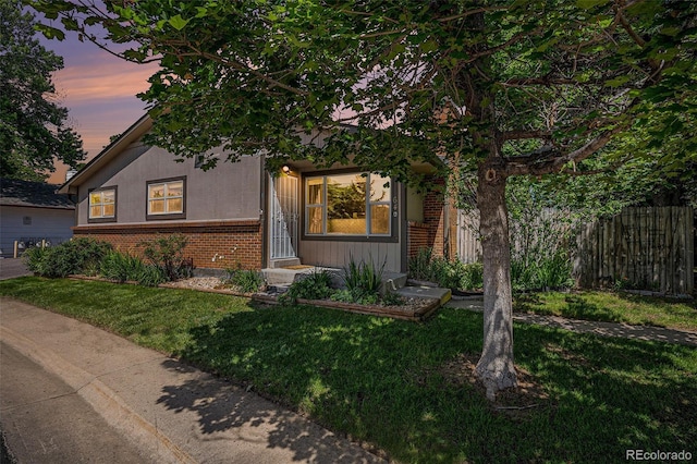 64 Nome Way Unit A, Aurora, CO 80012 - view of front facade featuring brick siding