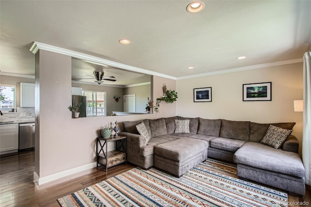 9146 W 89th Ct, Broomfield, CO 80021 - living room featuring dark wood-style flooring, recessed lighting, baseboards, ornamental molding, and ceiling fan
