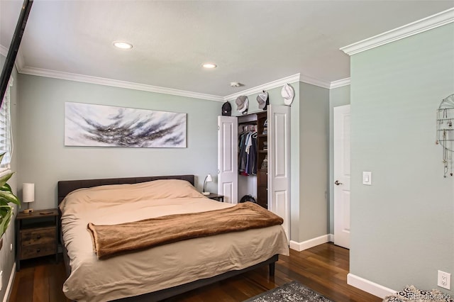 9146 W 89th Ct, Broomfield, CO 80021 - bedroom featuring wood-type flooring, crown molding, baseboards, recessed lighting, and a closet