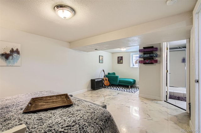 9146 W 89th Ct, Broomfield, CO 80021 - bedroom with baseboards, marble finish floors, and a textured ceiling