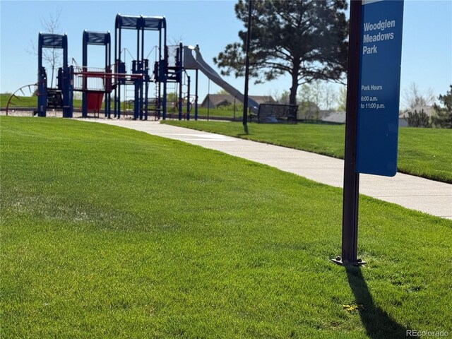 communal playground featuring a yard