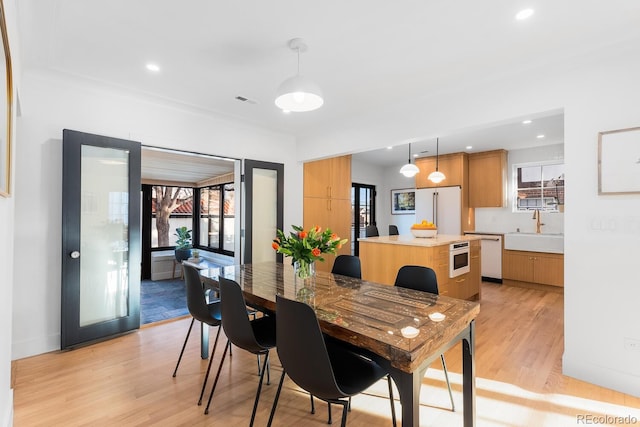 dining area with recessed lighting, visible vents, and light wood-style floors