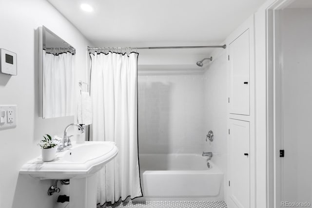 full bathroom featuring tile patterned flooring and shower / bath combo