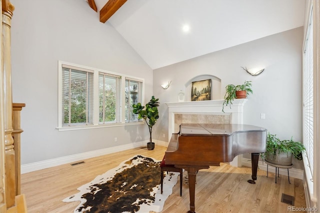 4059 Nevis St, Boulder, CO 80301 - sitting room featuring high vaulted ceiling, wood finished floors, beam ceiling, and baseboards