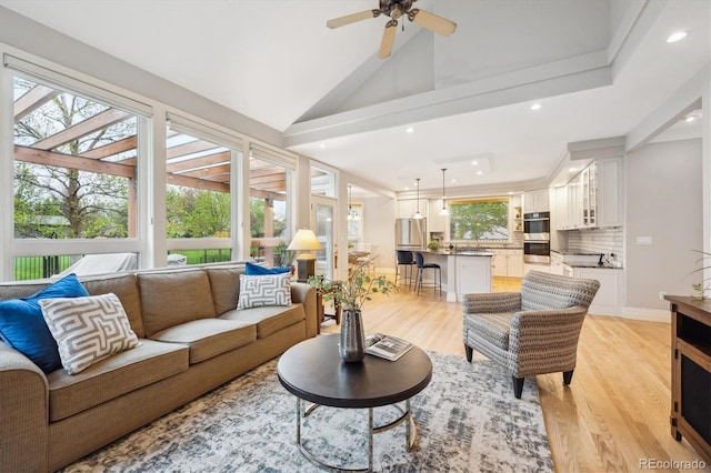 4059 Nevis St, Boulder, CO 80301 - living room with light wood-style flooring, recessed lighting, vaulted ceiling, and ceiling fan
