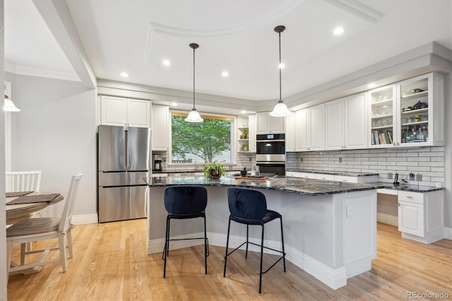 4059 Nevis St, Boulder, CO 80301 - kitchen with appliances with stainless steel finishes, a kitchen island, white cabinetry, backsplash, and recessed lighting