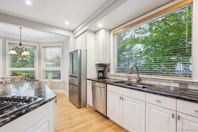 4059 Nevis St, Boulder, CO 80301 - kitchen featuring stainless steel appliances, a sink, backsplash, light wood-type flooring, and recessed lighting